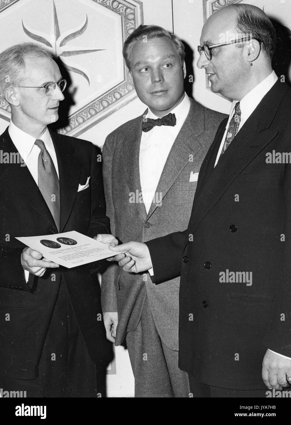 American television host Lynn Poole receiving an award for his work on the television show The Johns Hopkins Science Review, April 26, 1951. Stock Photo