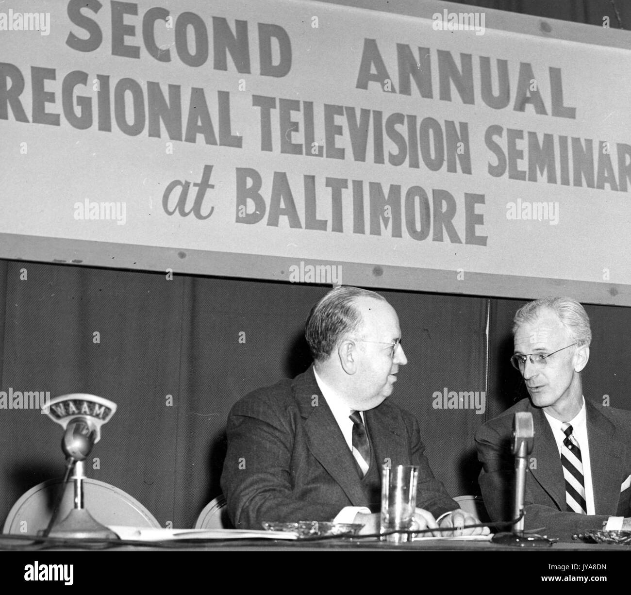 Show during the Second Annual Regional Television Review at Baltimore, featuring American television host Lynn Poole (right) and Dr Franklin Dunham (left), head of the Radio-TV Bureau of the US Office of Education, 1952. Stock Photo