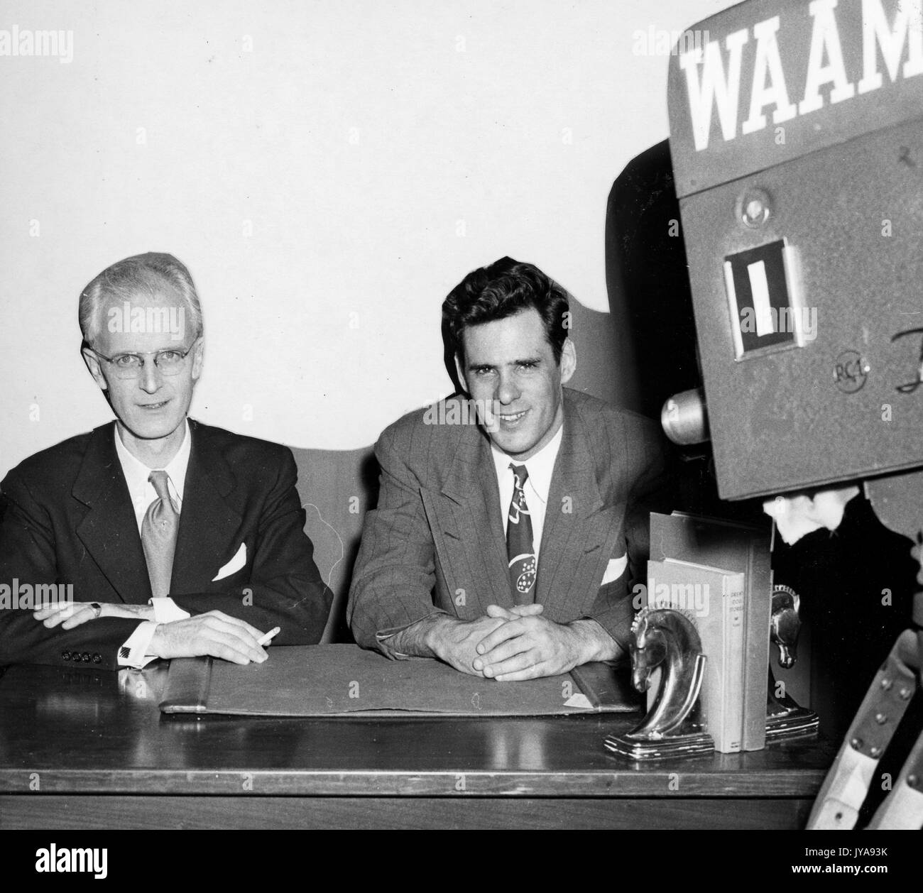 American television host Lynn Poole (left) on set of the Johns Hopkins Science Review television program with producer and director Anthony Farrar (right), 1951. Stock Photo