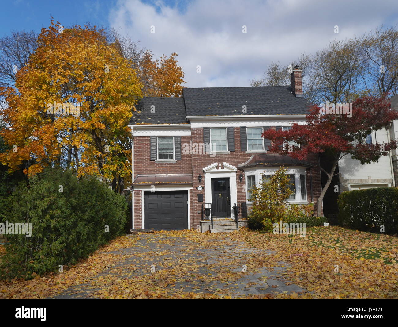 front yard of house in fall Stock Photo