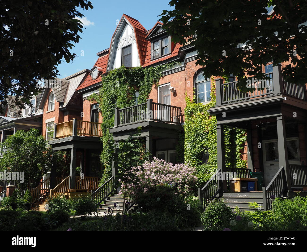 Victorian row of houses with gable roofs Stock Photo - Alamy