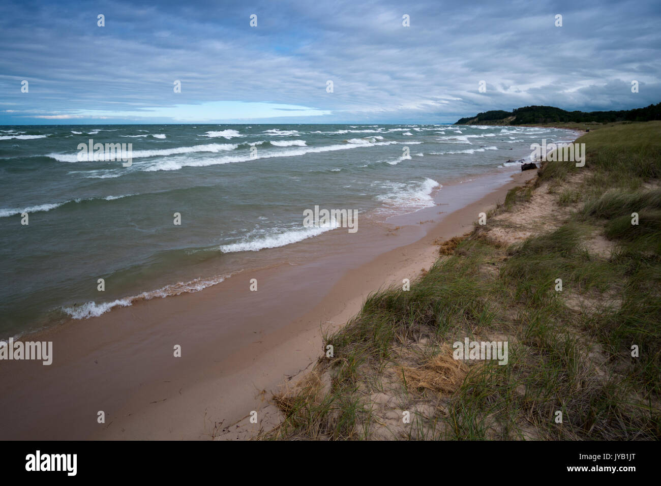 Lake Michigan near Whitehall, Michigan on a mid-August, stormy, blustery day with 5 to 6 foot waves crashing onto the beach. Stock Photo