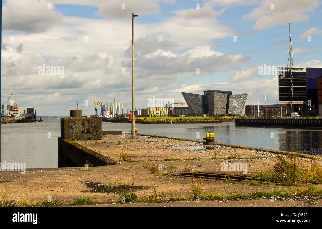 The River Lagan in Belfast including the iconic Titanic Centre from one of the disused ferry terminal loading ramps on Donegall Quay Stock Photo