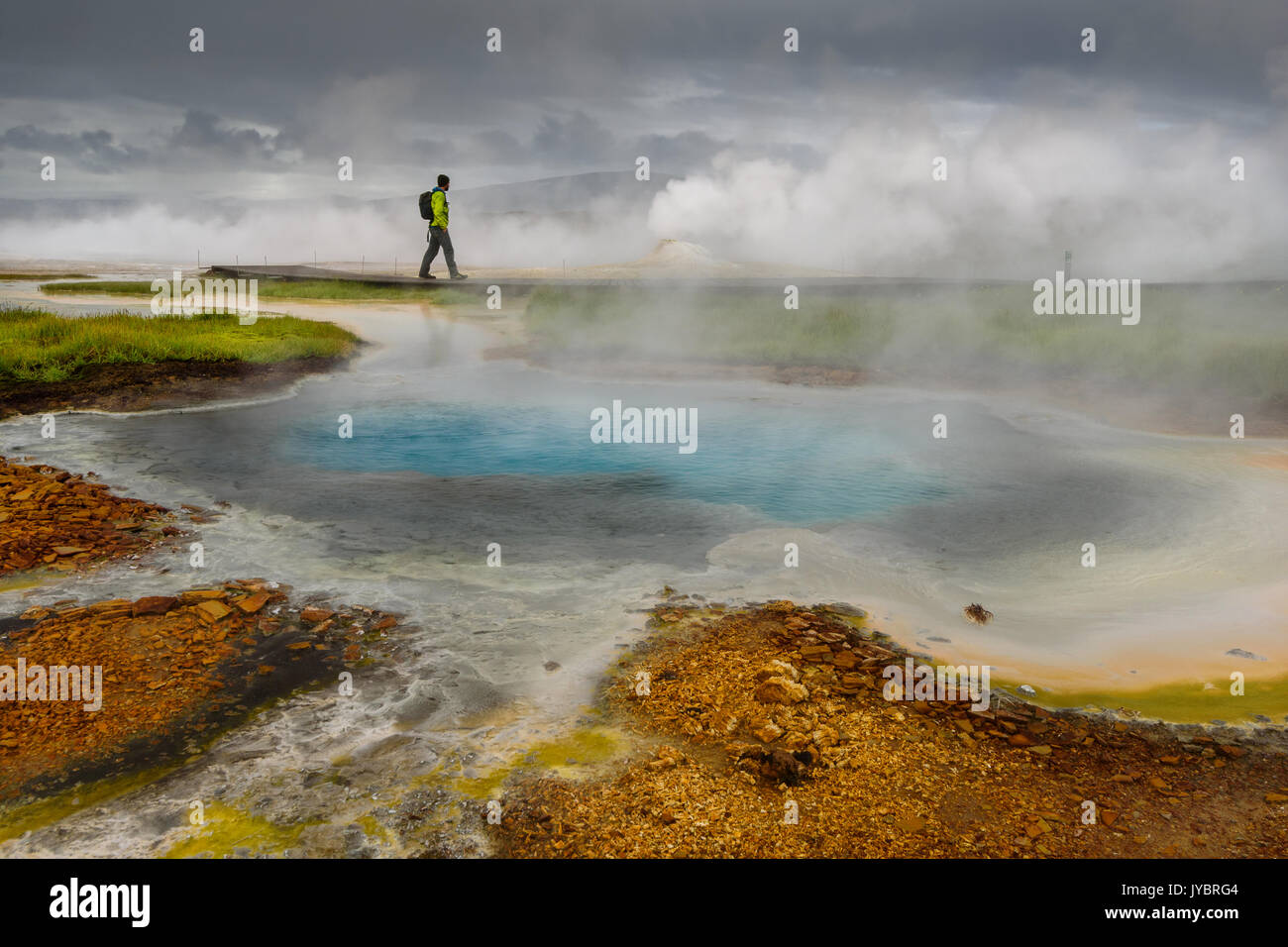 Hiker and Hot Spring at the geothermal area of Hveravellir. Stock Photo