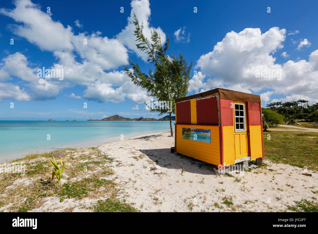 A colorful cabin frames the turquoise water of the Caribbean Sea Ffryers Beach Antigua and Barbuda Leeward Islands West Indies Stock Photo