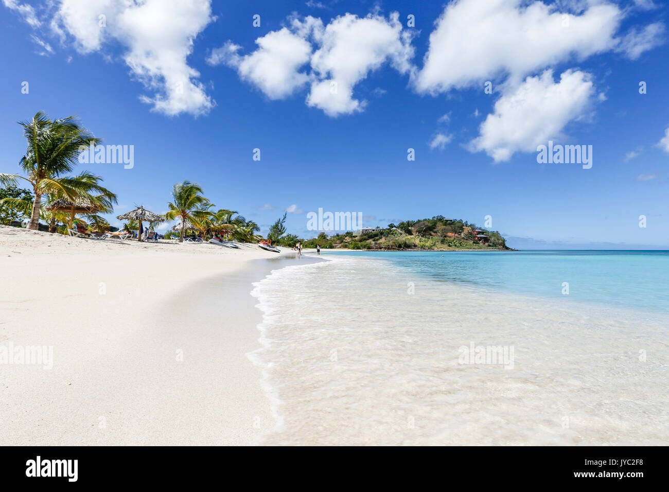 Palm trees and white sand surround the turquoise Caribbean sea Ffryers Beach Antigua and Barbuda Leeward Islands West Indies Stock Photo