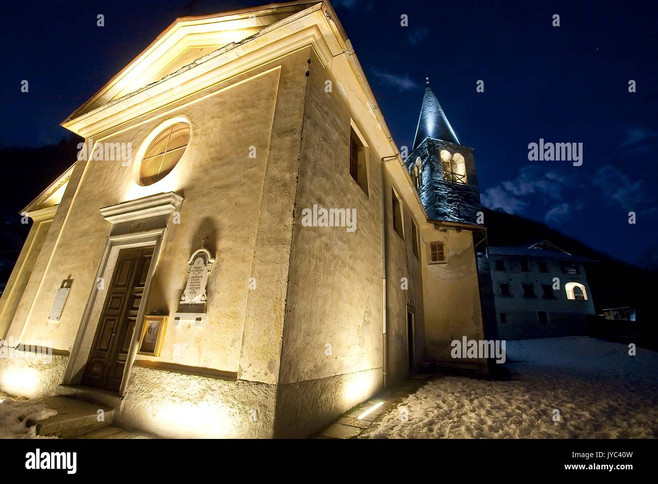 The well-lit church of Savogno, Bregaglia Valley, Switzerland Europe Stock Photo
