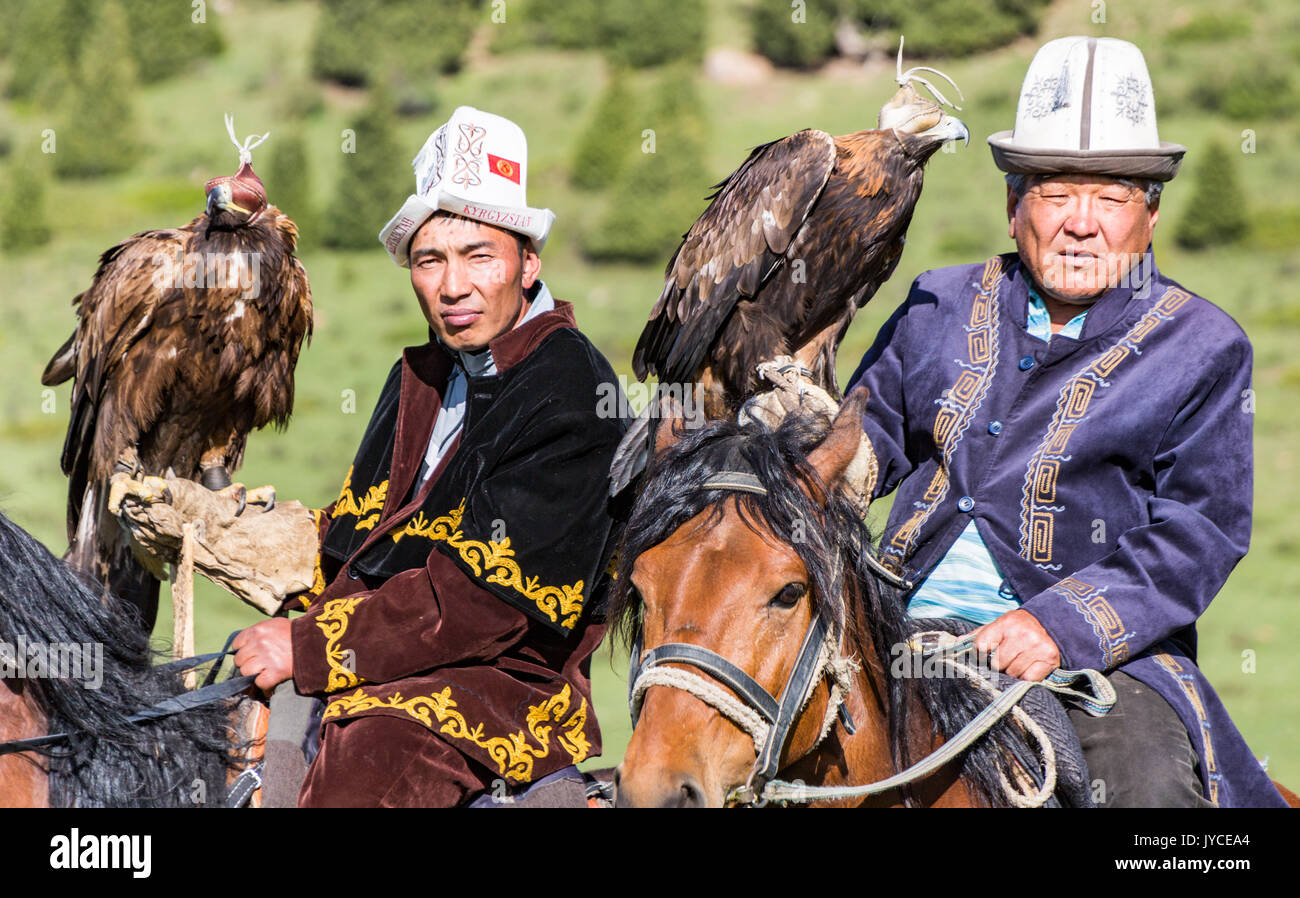 Eagle Hunters hold their eagles, ready for action in Kyrgyzstan on May