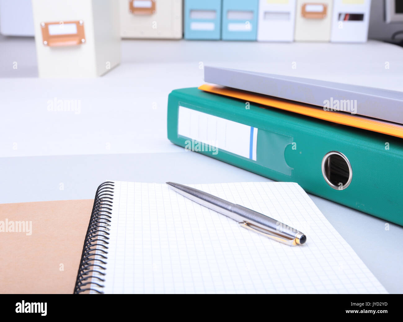 Folder file, note and pen on the desk. blurred background Stock Photo ...