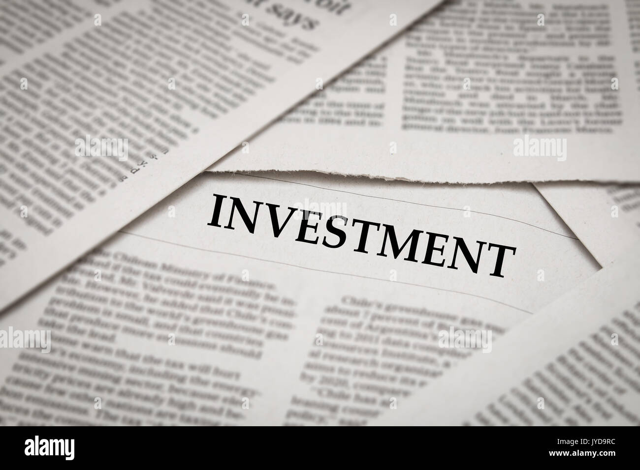 investment headline on newspaper background Stock Photo