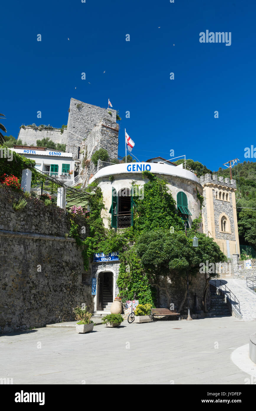 The Hotel Genio with medieval tower and green hills in the background Portovenere province of La Spezia Liguria Italy Europe Stock Photo