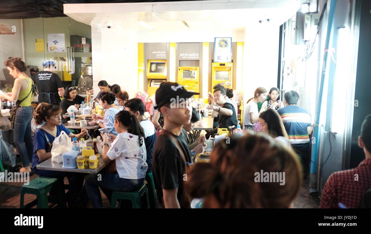 People in Dining Room in Bangkok Thailand Stock Photo