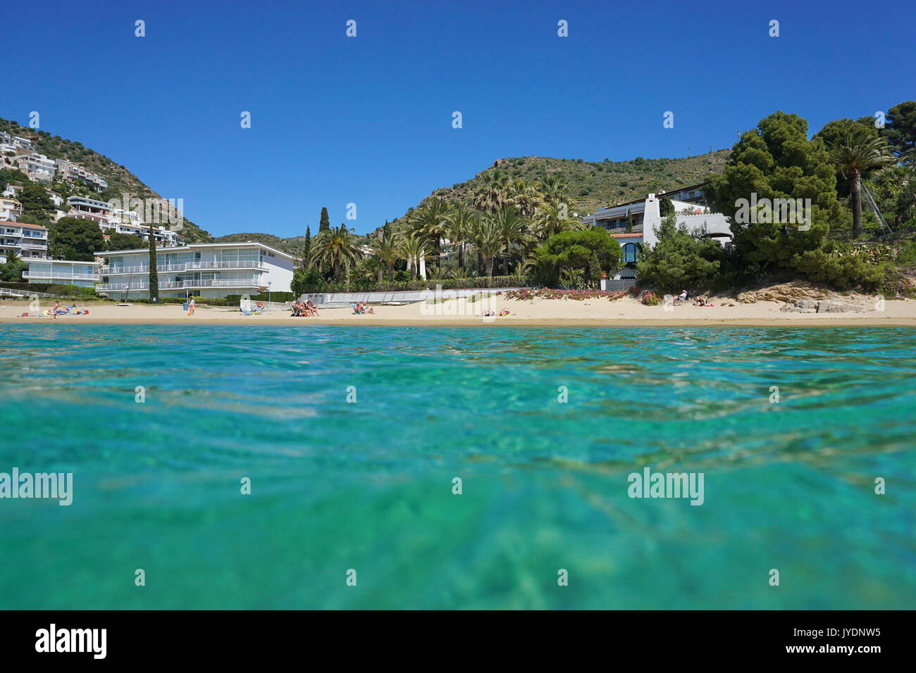 Mediterranean sandy beach coastline, seen from sea surface, Spain, Costa Brava, playa Almadrava, Canyelles Grosses, Roses, Girona, Catalonia Stock Photo