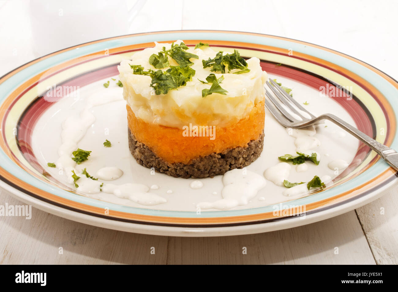 haggis, a very scottish dish, with mashed potato, turnips and parsley