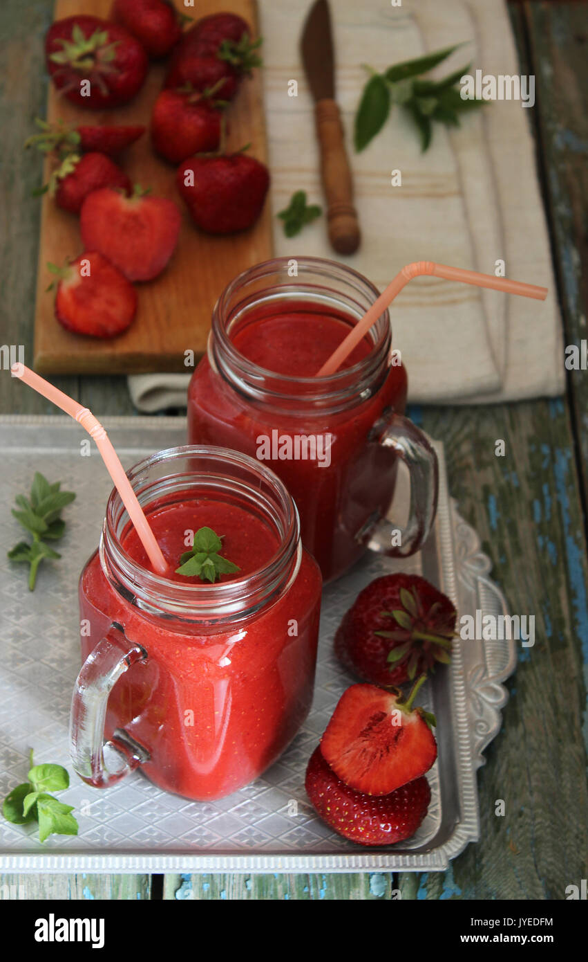 Strawberry smoothie, fresh fruits, leaf of mint Stock Photo - Alamy