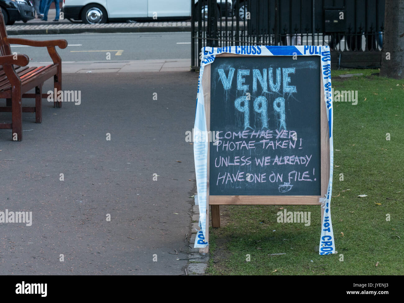 Police Scotland Command Unit stationed in Princes Street Gardens during Edinburgh Fringe Festival with humorous chalkboard sign Venue 999 Stock Photo