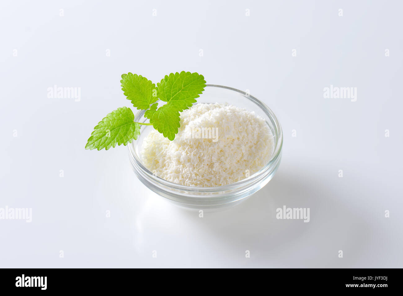 Dried grated unsweetened coconut meat Stock Photo Alamy