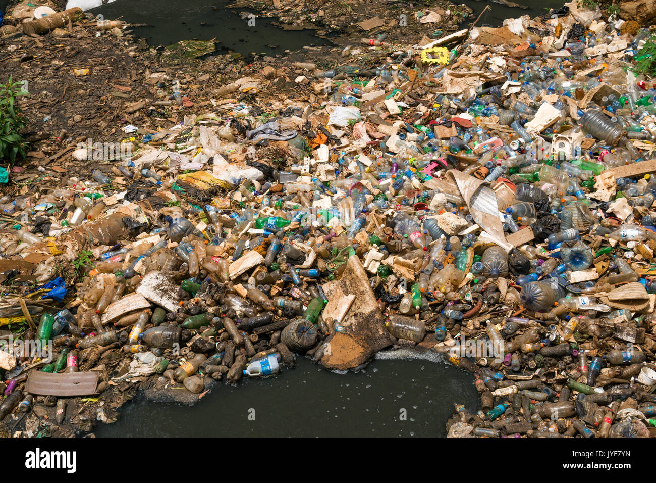 Plastic bottles and other waste rubbish blocking Nairobi river, Kenya Stock Photo