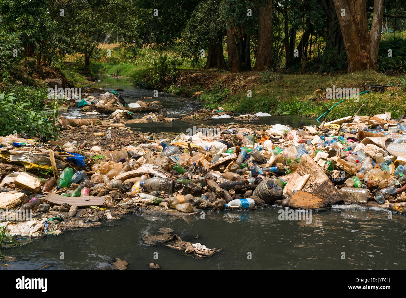 Plastic bottles and other waste rubbish blocking Nairobi river, Kenya Stock Photo