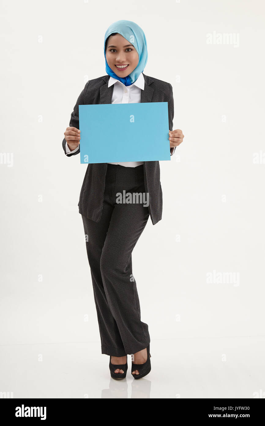 malay business woman with tudung holding a placard Stock Photo Alamy