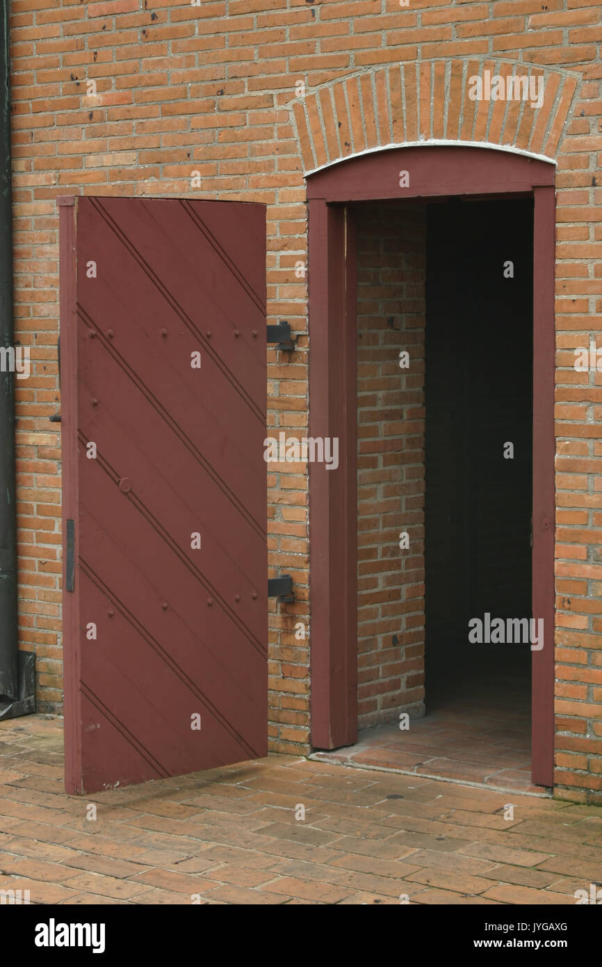 Antique door in brick wall Stock Photo Alamy