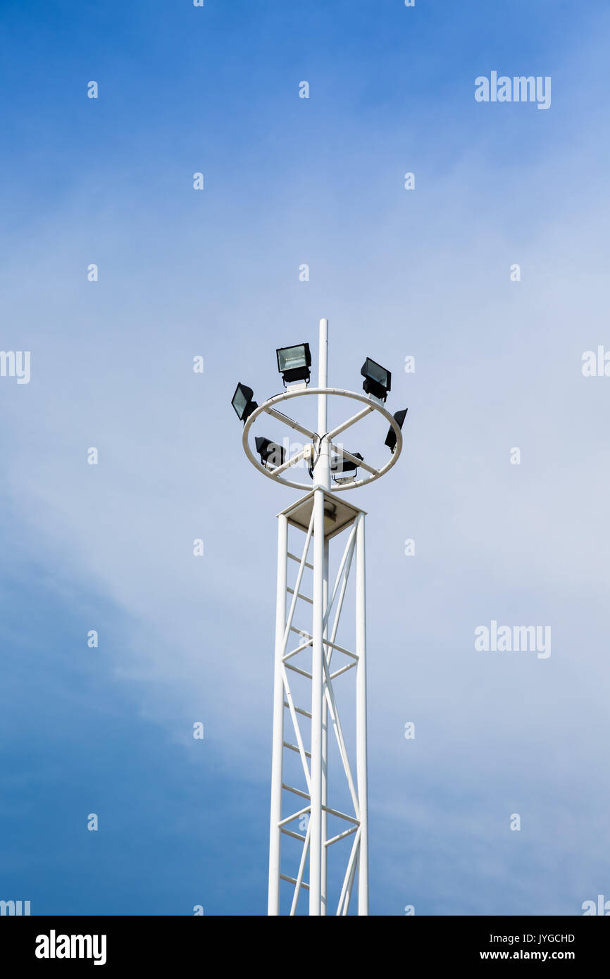 stadium light with pole on blue sky background Stock Photo - Alamy