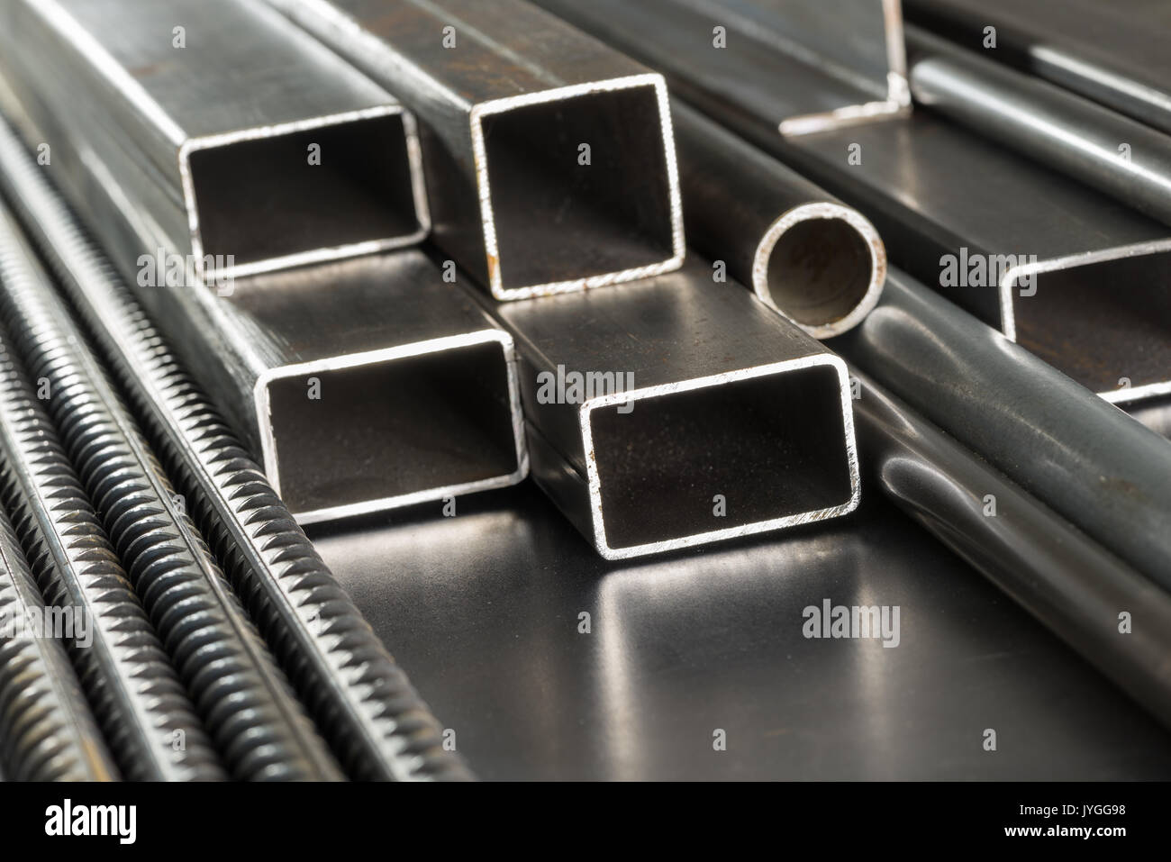Metal pipes and rods. Steel materials, construction supplies. Stock Photo