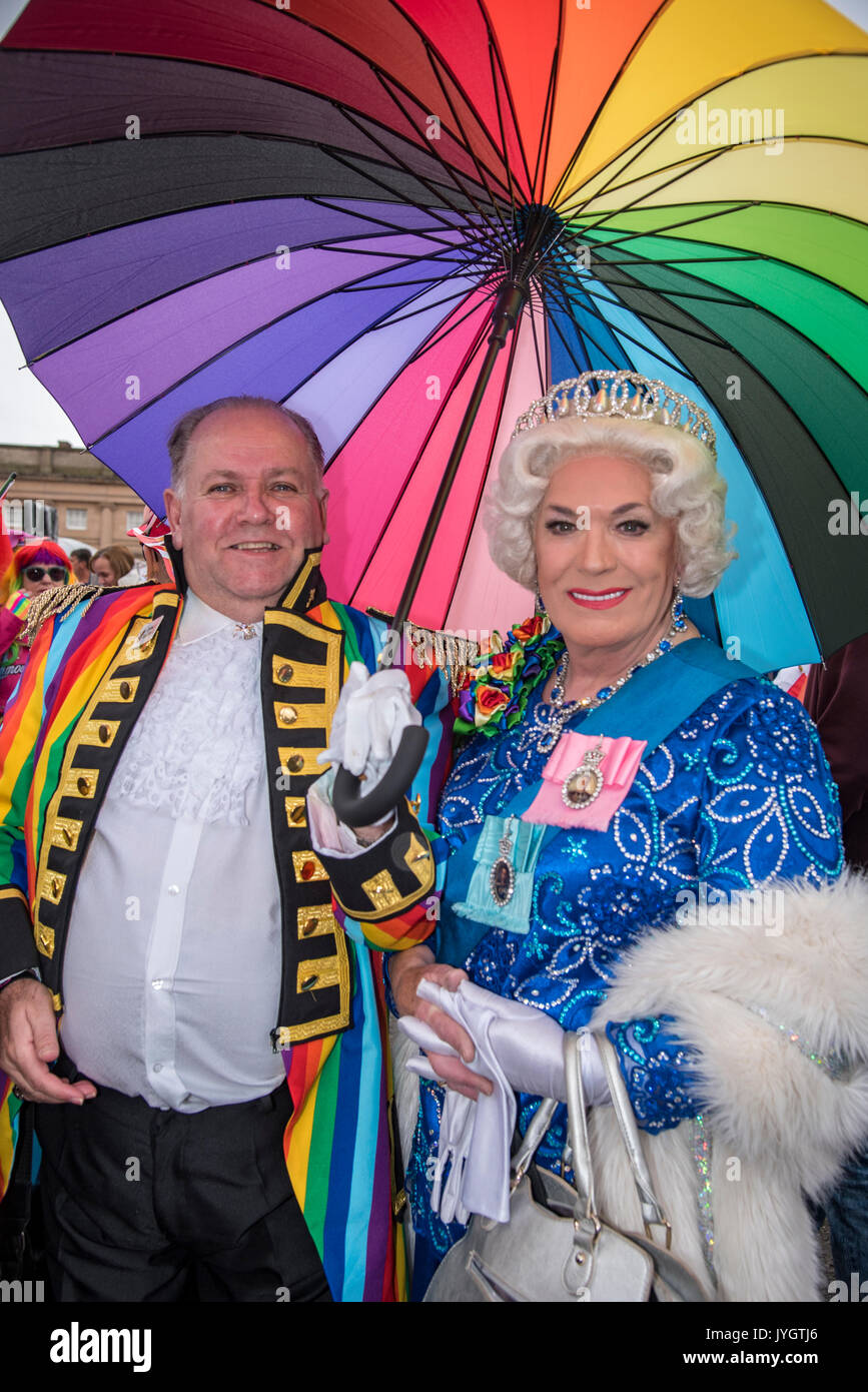Chester. United Kingdom. 19th August 2017. Scenes from the Chester Pride parade today in the centre of Chester. Hundreds turned out in the rain to take part in LGBT celebration with many dressed in colourfull costumes. Pictured is councillor Mallie Poulton ( left ) with parade queen. The event is supported by local business. Credit: John Davidson Photos/Alamy Live News Stock Photo