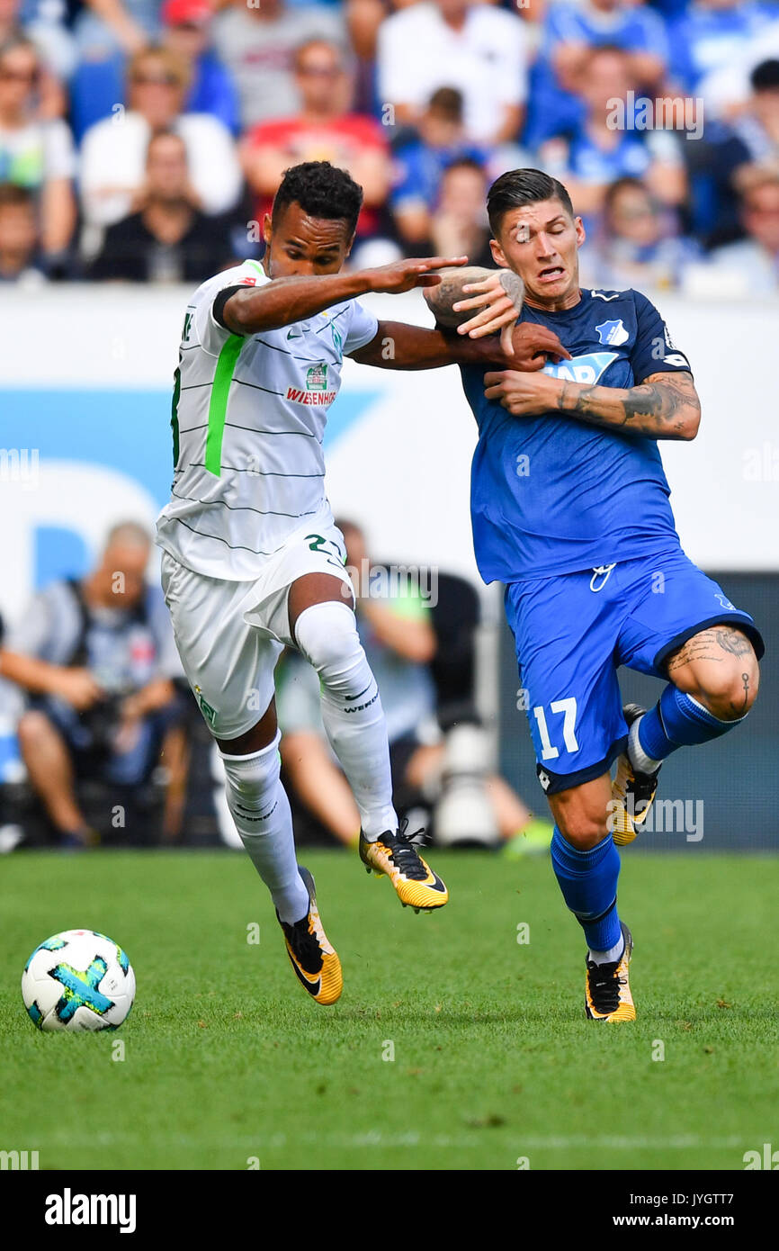 Bremen's Theodor Gebre Selassie (L) and Hoffenheim's Steven Zuber vie for the ball during the German Bundesliga soccer match between 1899 Hoffenheim and Werder Bremen in the Rhein-Necker-Arena in Sinsheim, Germany, 18 August 2017.(EMBARGO CONDITIONS - ATTENTION: Due to the accreditation guidelines, the DFL only permits the publication and utilisation of up to 15 pictures per match on the internet and in online media during the match.) Photo: Uwe Anspach/dpa Stock Photo
