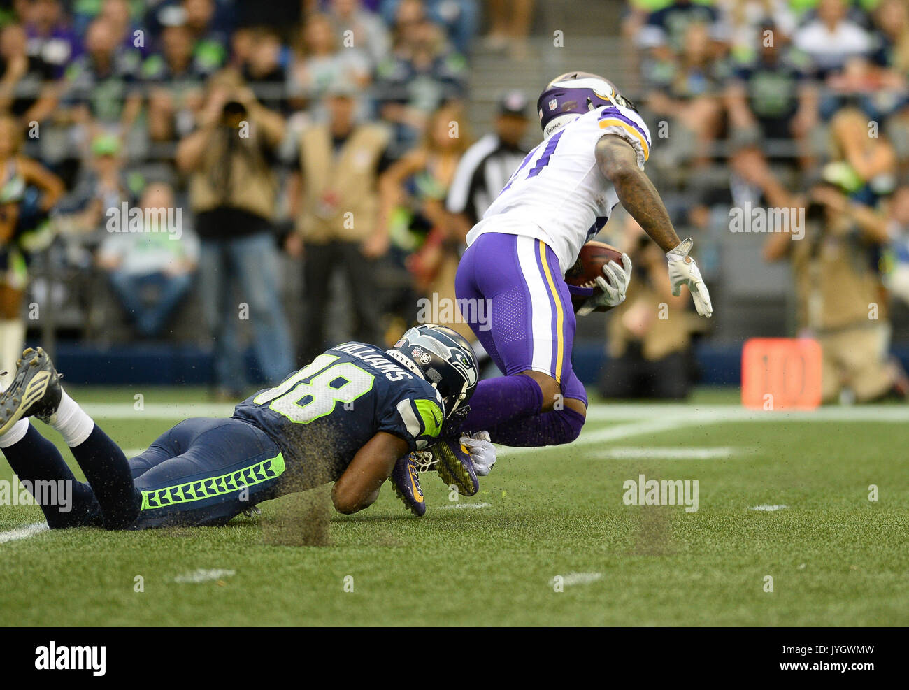 August 18, 2017: Seattle's Kasen Williams (18) tackles Minnesota's Jerick McKinnon (21) during a kick return during an NFL pre-season game between the Seattle Seahawks and the Minnesota Vikings. The game was played at Century Link Field in Seattle, WA. © Jeff Halstead / CSM Stock Photo