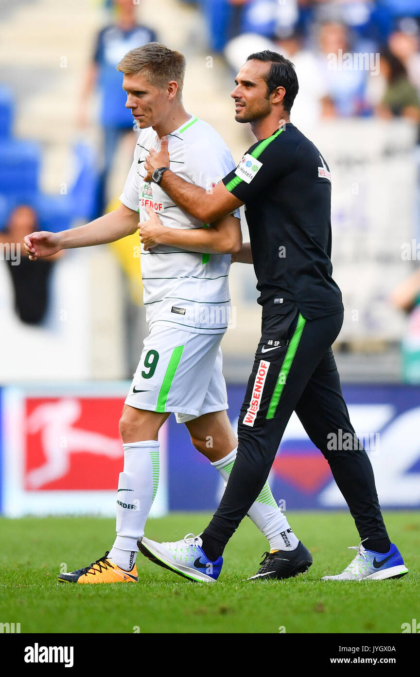Sinsheim, Germany. 18th Aug, 2017. Bremen's Aron Johannsson and Bremen's coach Alexander Nouri leave the pitch after the ending of the German Bundesliga soccer match between 1899 Hoffenheim and Werder Bremen in the Rhein-Necker-Arena in Sinsheim, Germany, 18 August 2017.(EMBARGO CONDITIONS - ATTENTION: Due to the accreditation guidelines, the DFL only permits the publication and utilisation of up to 15 pictures per match on the internet and in online media during the match.) Photo: Uwe Anspach/dpa/Alamy Live News Stock Photo