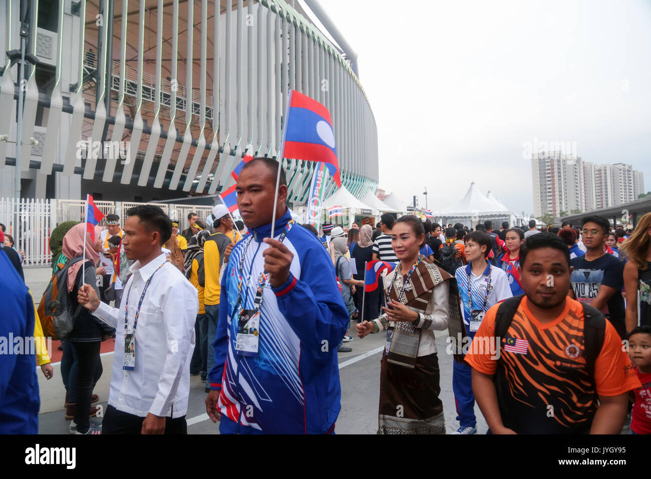 LAOS athletes and officers group outside the national stadium during the opening ceremony of 29th SEA games. Credit: Calvin Chan/Alamy Live News Stock Photo