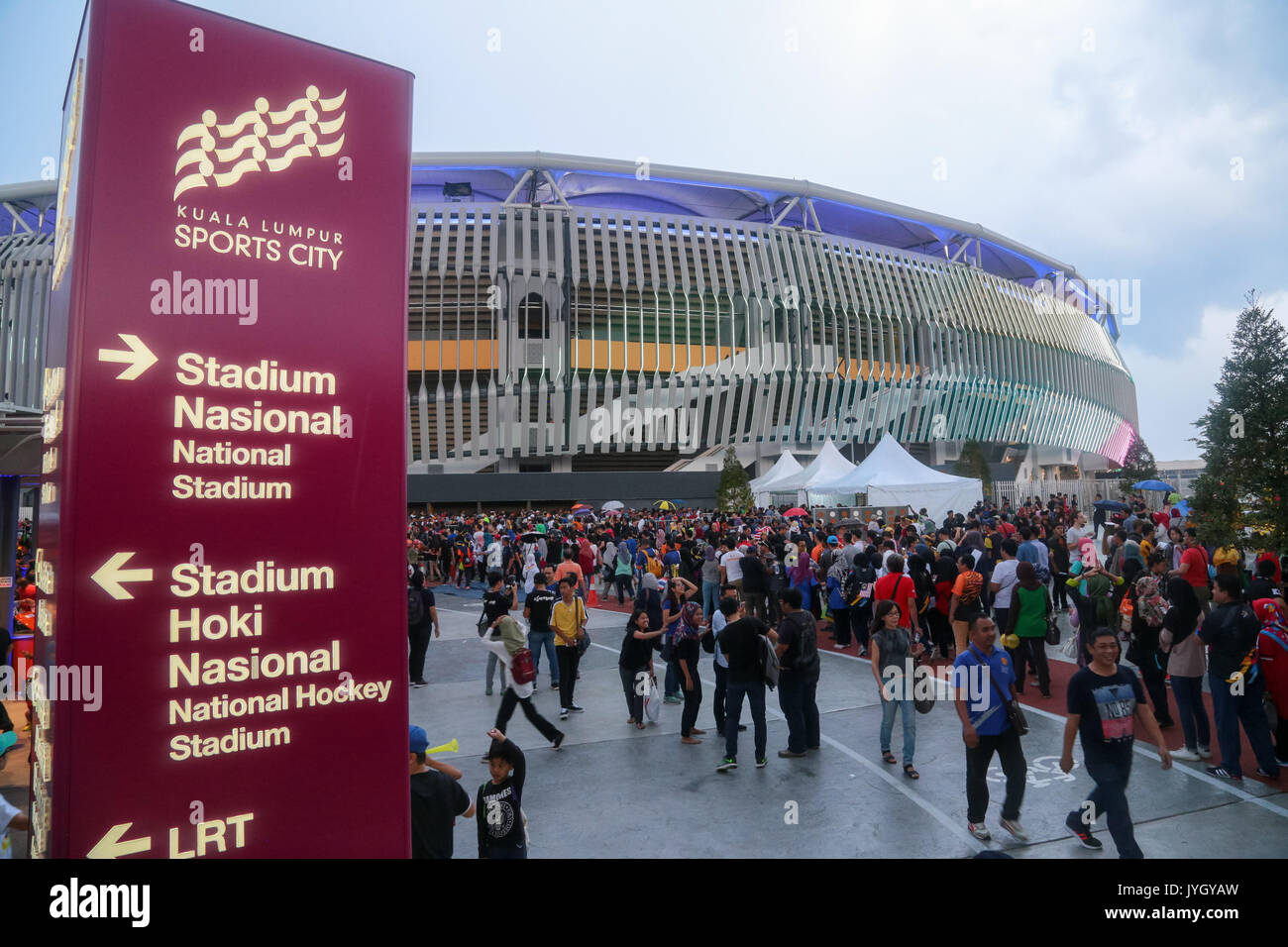 Crowd queue up to enter the national stadium to witness the opening ceremony of 29th SEA games. Credit: Calvin Chan/Alamy Live News Stock Photo