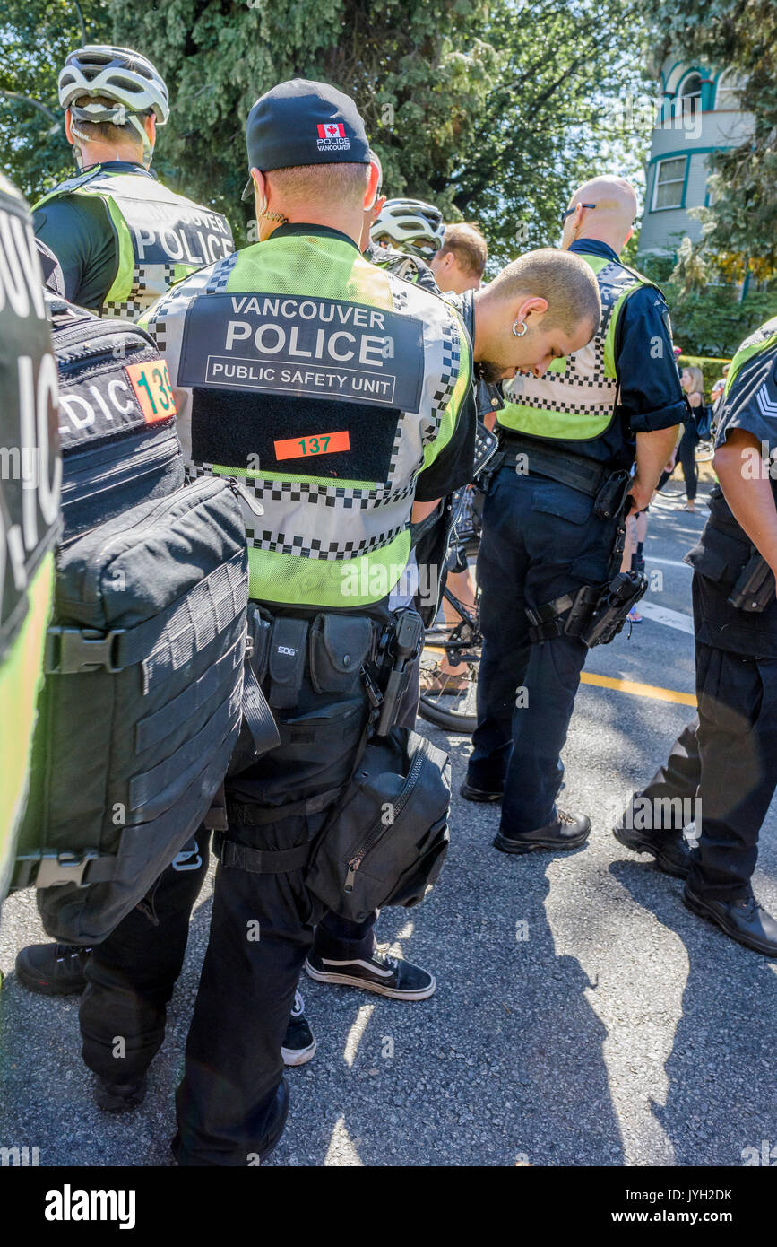 Vancouver, Canada. 19th Aug, 2017. Man detained by police for harrassing anti-refugee protester at Anti-Racism counter rally, City Hall, Vancouver, British Columbia, Canada. Credit: Michael Wheatley/Alamy Live News Stock Photo