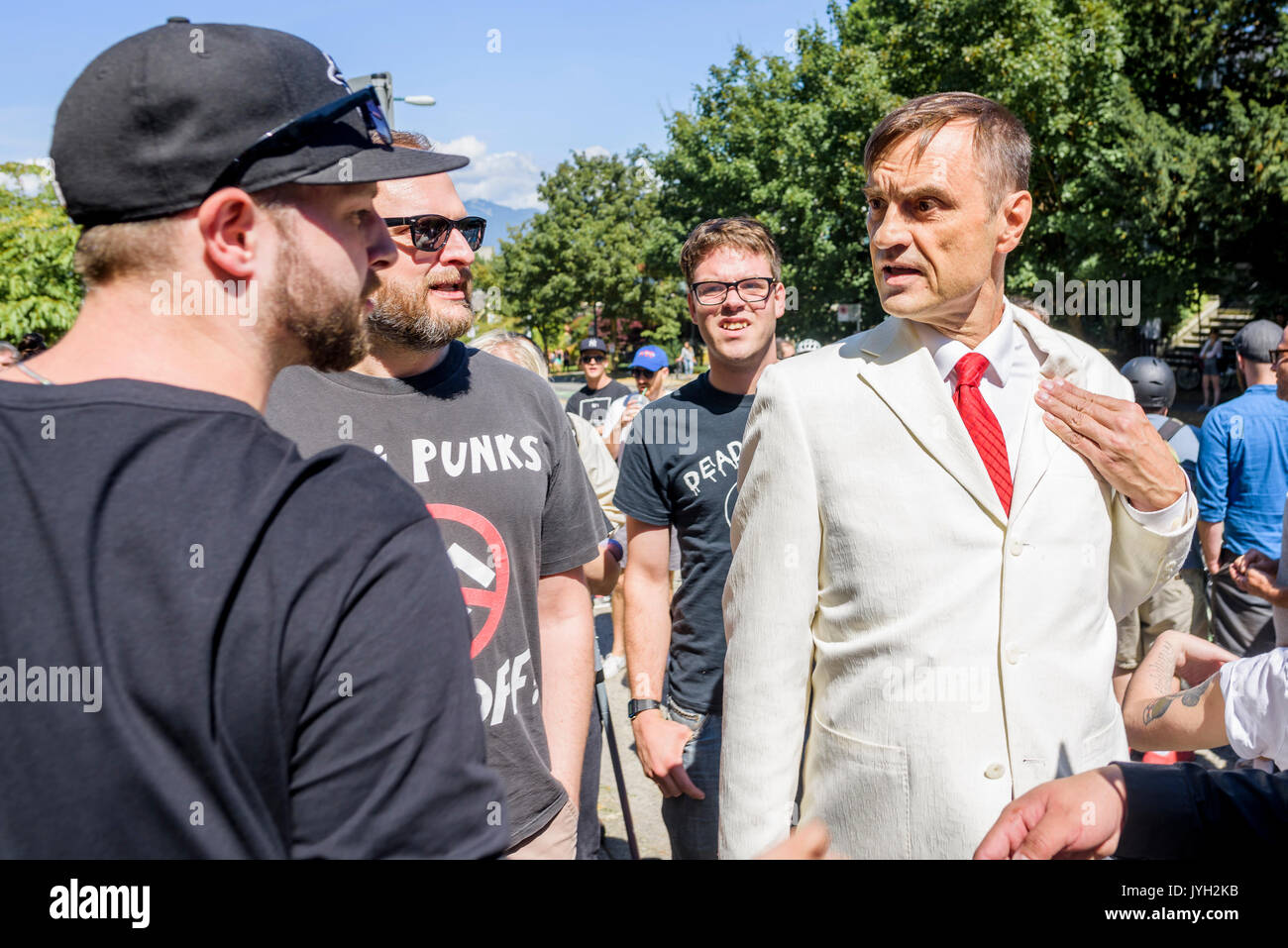 Vancouver, Canada. 19th Aug, 2017. Self professed nazi has nazi button ripped from jacket at Anti-Racism rally, City Hall, Vancouver, British Columbia, Canada. Credit: Michael Wheatley/Alamy Live News Stock Photo