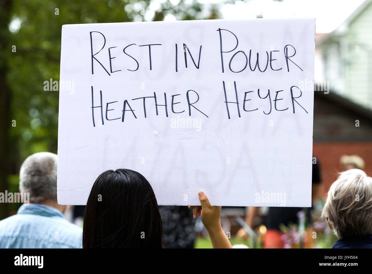Kingston, Ontario, Canada. 19th Aug, 2017. A woman holds a sign for Heather Heyer during an anti-racism rally in Kingston, Ont., on Aug. 19, 2017. Credit: Lars Hagberg/ZUMA Wire/Alamy Live News Stock Photo