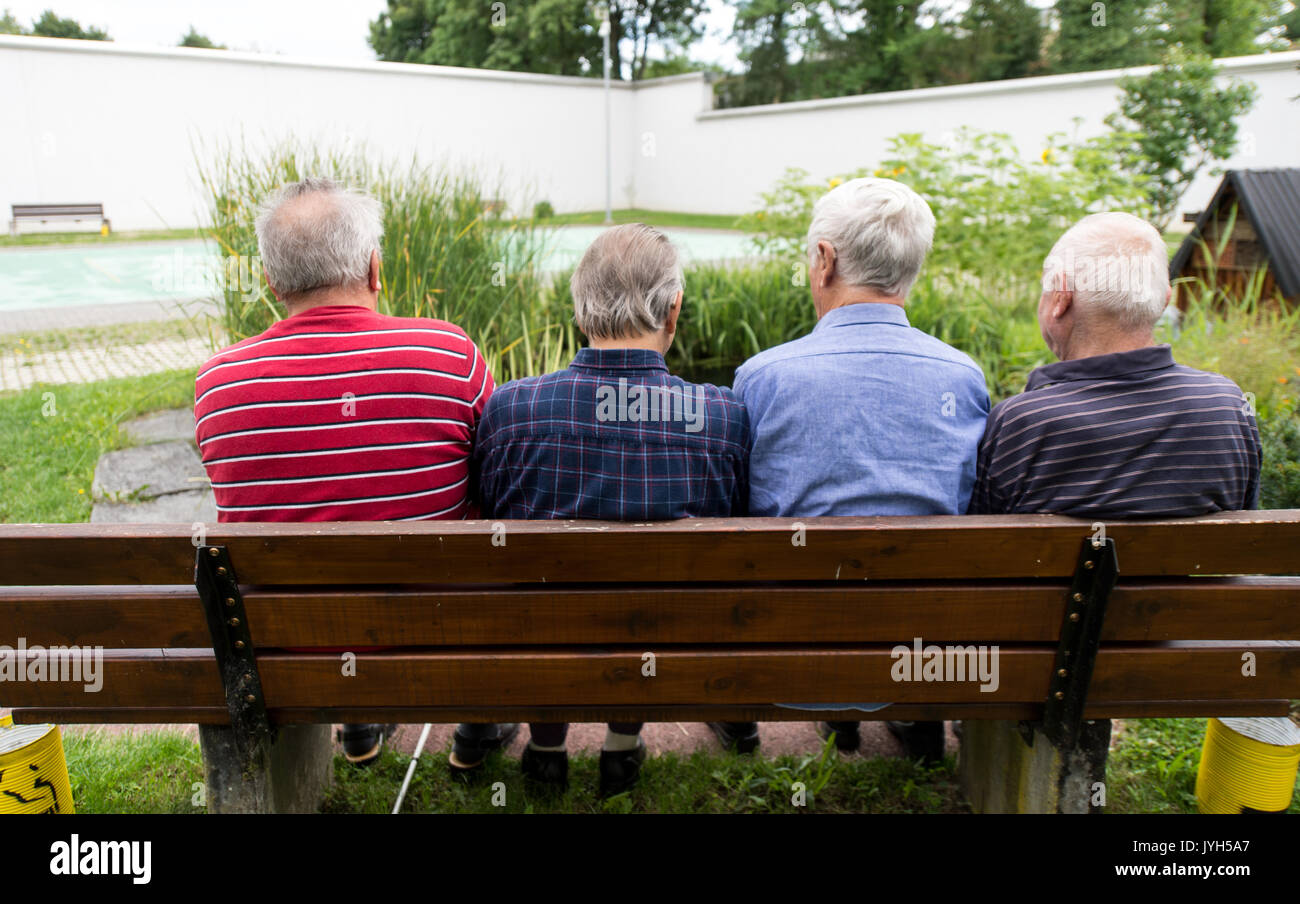 Singen, Germany. 27th July, 2017. Four inmates of the prison sit on a
