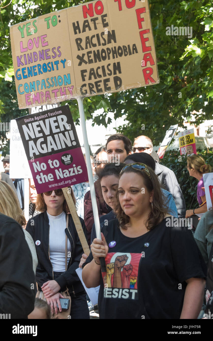London, UK. 19th Aug, 2017. People at the Stand Up to Trump protest outside the US Embassy include a woman with a lengthy hand made placard. The organisation is supported by around 20 organisations including the CWU, NUT, Unite, UCU, CND, Stop the War, Campaign Against Climate Change, Muslim Association of Britain and others. K Stock Photo