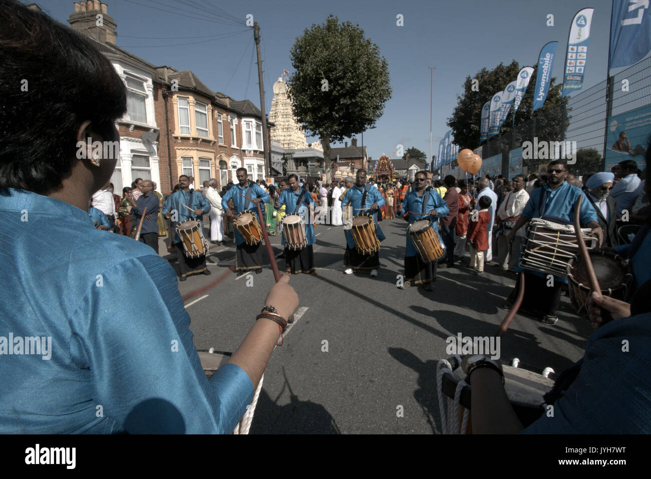 London, UK. 20th Aug, 2017. The London Sri Murgan Temple in East London celebrated the Chariot festival, stating with the blessing of the deities inside the temple, after taken into to a chariot where huge crowds gathering to follow it trough the streets of East Ham, in a colorful rainbow of colours, food was blessed by the priest and passed back for the people to take home and eat Credit: Paul Quezada-Neiman/Alamy Live News Stock Photo