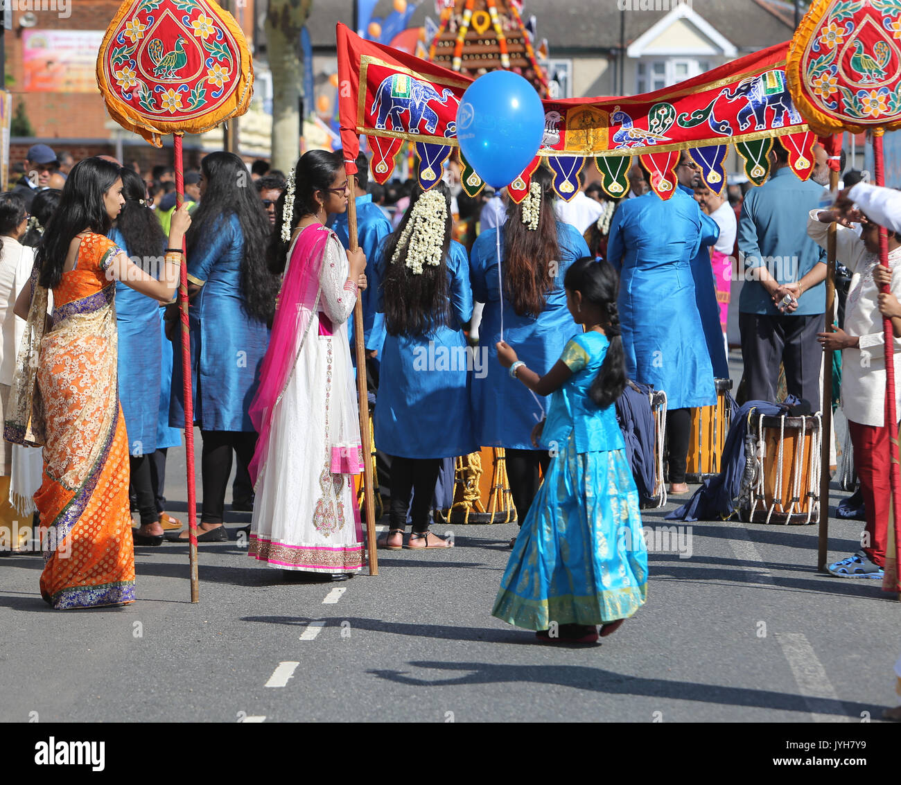 London, UK. 20th Aug, 2017. The London Sri Murgan Temple in East London celebrated the Chariot festival, stating with the blessing of the deities inside the temple, after taken into to a chariot where huge crowds gathering to follow it trough the streets of East Ham, in a colorful rainbow of colours, food was blessed by the priest and passed back for the people to take home and eat Credit: Paul Quezada-Neiman/Alamy Live News Stock Photo