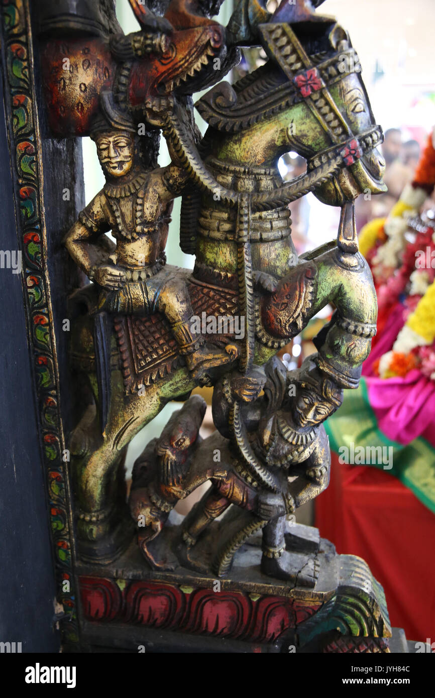 London, UK. 20th Aug, 2017. The London Sri Murgan Temple in East London celebrated the Chariot festival, stating with the blessing of the deities inside the temple, after taken into to a chariot where huge crowds gathering to follow it trough the streets of East Ham, in a colorful rainbow of colours, food was blessed by the priest and passed back for the people to take home and eat Credit: Paul Quezada-Neiman/Alamy Live News Stock Photo