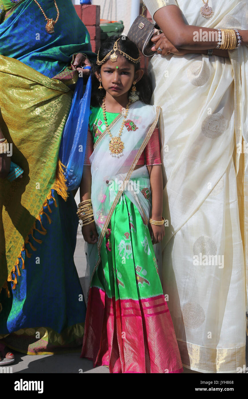 London, UK. 20th Aug, 2017. The London Sri Murgan Temple in East London celebrated the Chariot festival, stating with the blessing of the deities inside the temple, after taken into to a chariot where huge crowds gathering to follow it trough the streets of East Ham, in a colorful rainbow of colours, food was blessed by the priest and passed back for the people to take home and eat Credit: Paul Quezada-Neiman/Alamy Live News Stock Photo