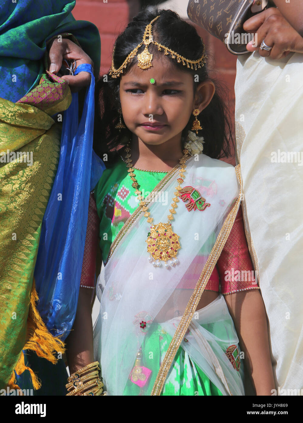 London, UK. 20th Aug, 2017. The London Sri Murgan Temple in East London celebrated the Chariot festival, stating with the blessing of the deities inside the temple, after taken into to a chariot where huge crowds gathering to follow it trough the streets of East Ham, in a colorful rainbow of colours, food was blessed by the priest and passed back for the people to take home and eat Credit: Paul Quezada-Neiman/Alamy Live News Stock Photo