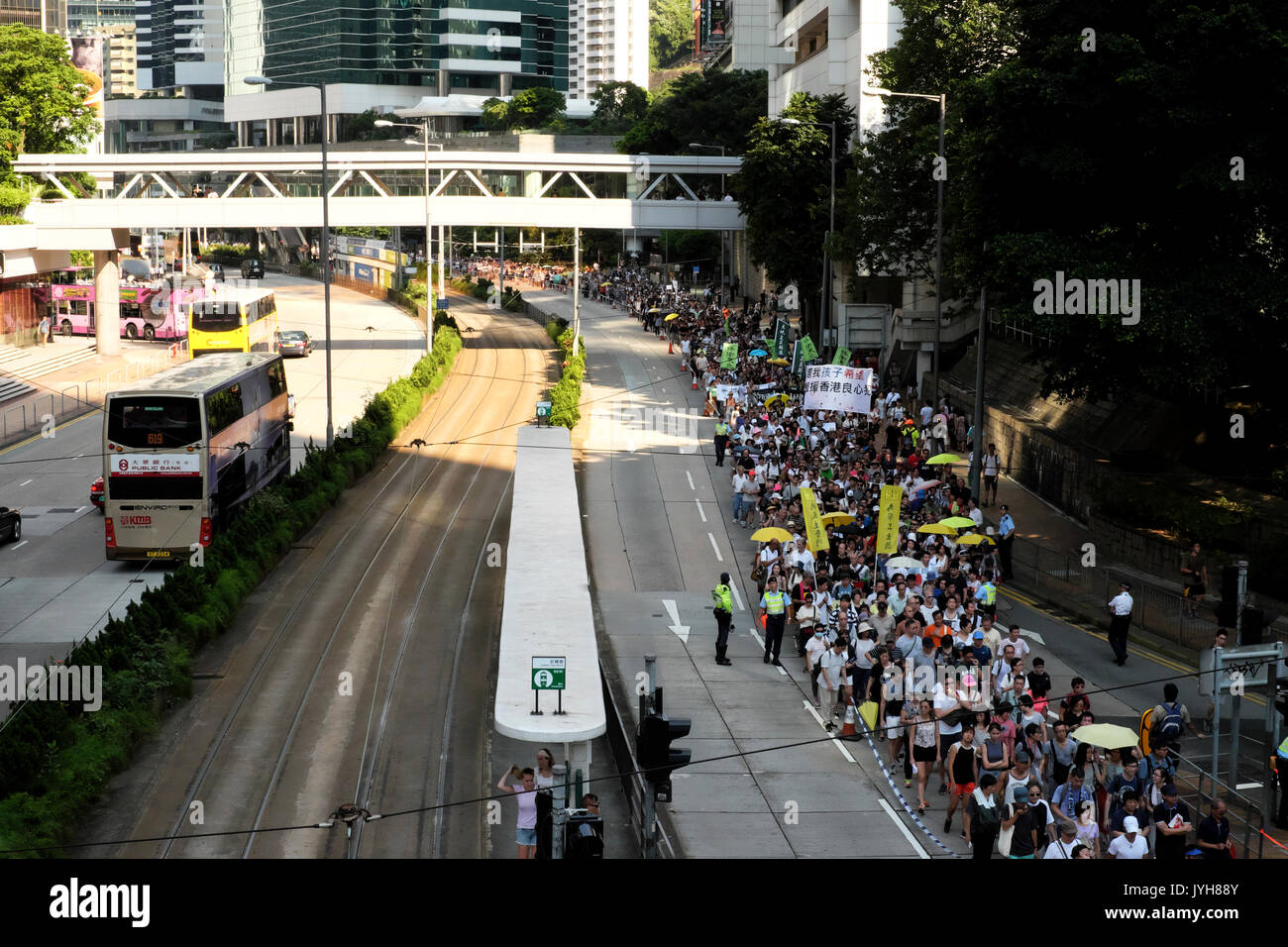 Hong Kong. 20th Aug, 2017. Protesters march around Hong Kong Island Central in support of the democracy campaigners Jashua Wong, Alex Chow, and Nathan Law, who were detained over anti-China protests. And 30 more activists were sentenced to jail. Credit: Mohamed Elsayyed/Alamy Live News Stock Photo