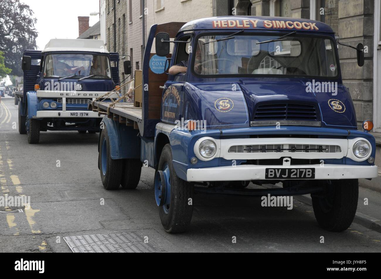 Kington, , UK. 20th Aug, 2017. The Herefordshire market town of Kington came to a standstill while a parade of vintage vehicles made their way to the Kington Vintage Club's 25th Annual Show. Two vintage Bedford Hedley Simcock coal lorrys make their way up to the High Street. Credit: Andrew Compton/Alamy Live News Stock Photo