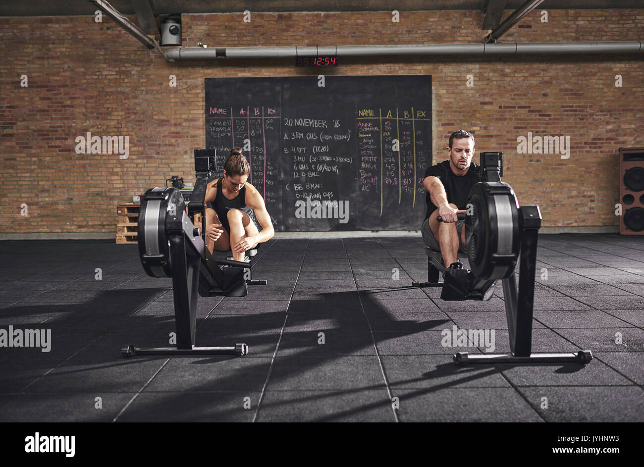 Man and woman muscles working out hi-res stock photography and images ...