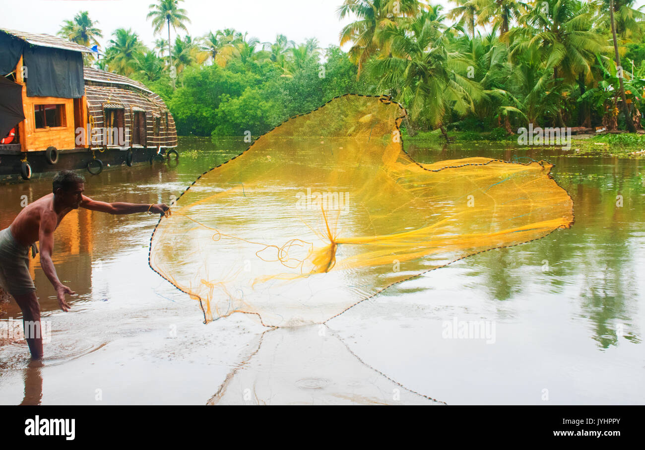 FISHERMAN WITH HIS FISHING NET, 'NO ONE WILL DO THIS PROPERLY UNLESS HE IS A FISHERMAN' Stock Photo