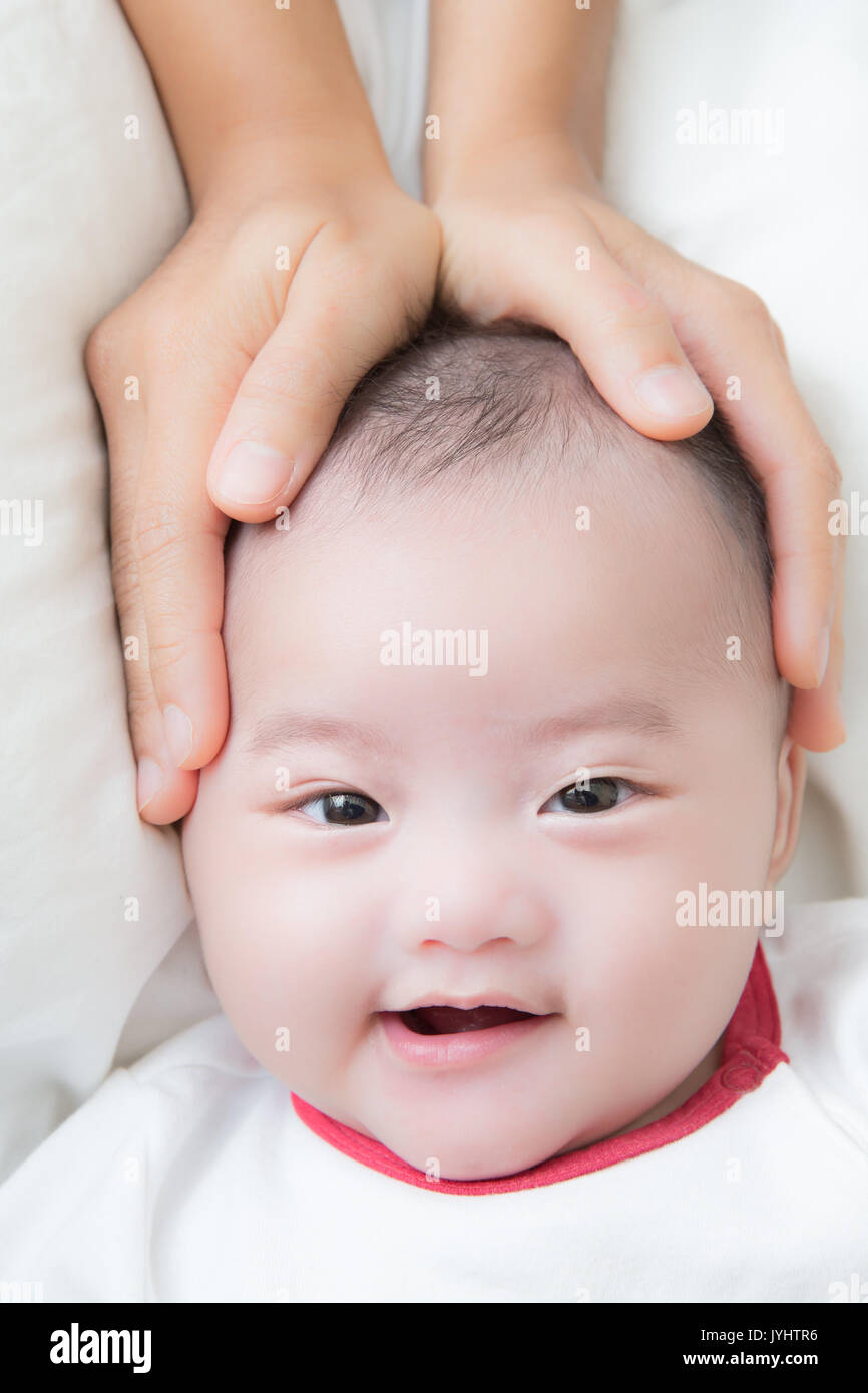 baby massage concept with asian baby boy smiling Stock Photo Alamy