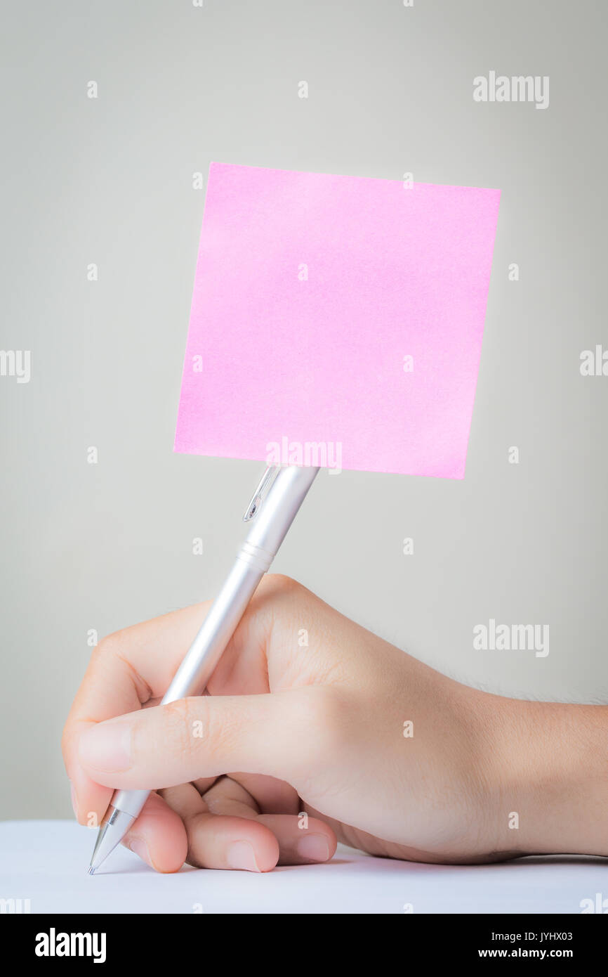 blank pink notepad stick with pen Stock Photo