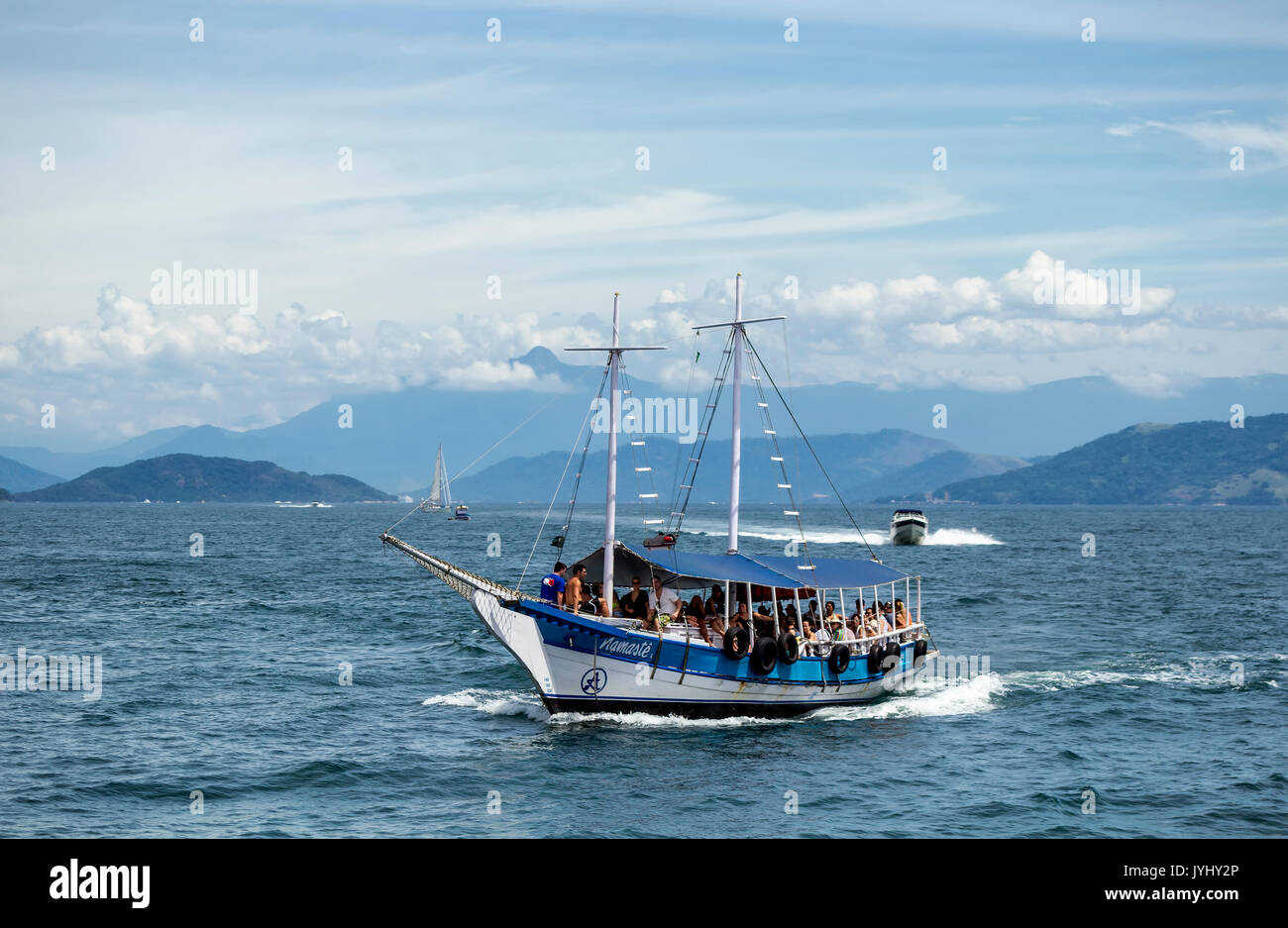 Angra dos Reis, Rio de Janeiro, March, 2014: Sloop Boat in Angra dos Reis bay area during the summer time, carrying tourists to the different beaches  Stock Photo